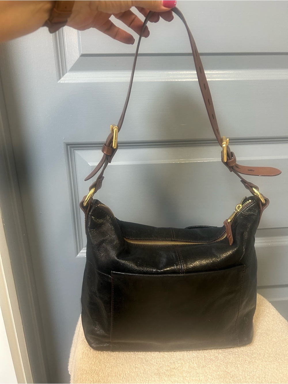 HOBO Black crinkle leather with brown adjustable shoulder strap. 2 outer pockets